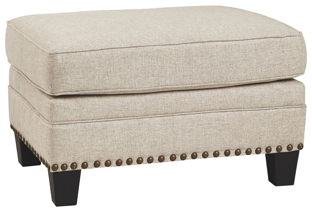 A case of contemporary and classic style influences coming together in a beautiful way, this ottoman in beige brings a fresh perspective to modern farmhouse living. Distinctive elements include nailhead trim and a lovely linen-weave upholstery for an up-t