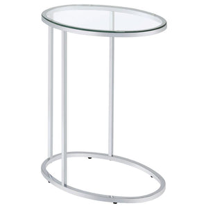 This oval side table features a sleek, modern design with a clear tempered glass top that offers both durability and elegance. Its minimalist metal frame, electroplated in chrome, provides a polished, reflective finish that enhances its contemporary aesth