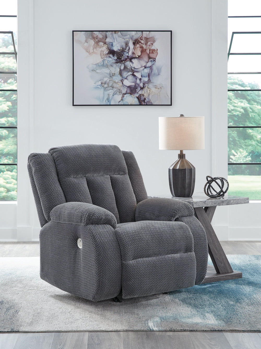 There-'s no need to sacrifice looks for comfortâ€”this power rocker recliner serves up both, plus a richly relaxed sense of style. Its steel-hued velvet upholstery is ultra soft, with a plush waffle weave for an added layer of interest. The overstuffed pi