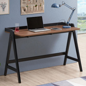  this industrial style writing desk offers a minimal aesthetic to a home office space. A black trestle base in an A-frame design supports a clean tabletop surface in a rich walnut finish