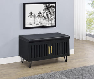  featuring a faux leather upholstered padded top for added versatility as a seating bench. The cabinetâ€™s two doors showcase a vertical slat design
