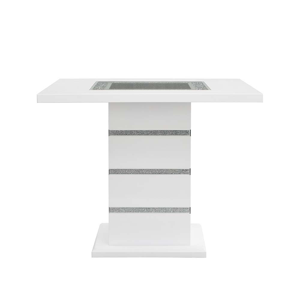 Perfect for a kitchen nook or a smaller dining space, the Elizaveta counter height dining table will fulfill all your dining needs. The white high gloss finish blends in perfectly with the glimmering faux diamond inlay base. The tabletop features silver a