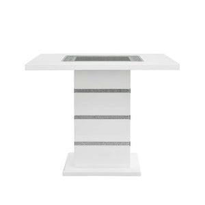  the Elizaveta counter height dining table will fulfill all your dining needs. The white high gloss finish blends in perfectly with the glimmering faux diamond inlay base. The tabletop features silver a