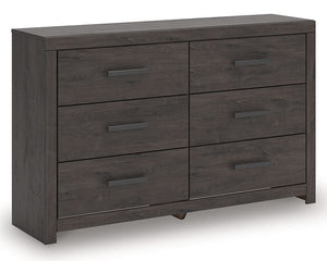 Designed with everyday style in mind, this dresser is a simply chic approach to modern living. A dark charcoal finish blends black and brown undertones, creating a versatile look that effortlessly pairs with your existing pieces. And for must-have functio
