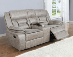 Every entertainment area deserves this glider loveseat with console. The neutral color palette makes it easy to blend with your decor. Its leatherette upholstery ensures a comfortable seating experience. A center console offers a small storage area for re