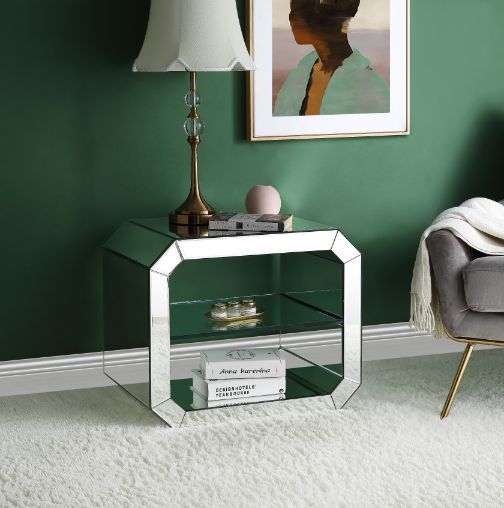 Beauty, simplicity, and functionality combine to create the Meria Accent Table that will truly become one of the main focal points in your room areas. Clean-lined table frame in mirrored finish creates a modern glamour look. There is a tempered glass shel