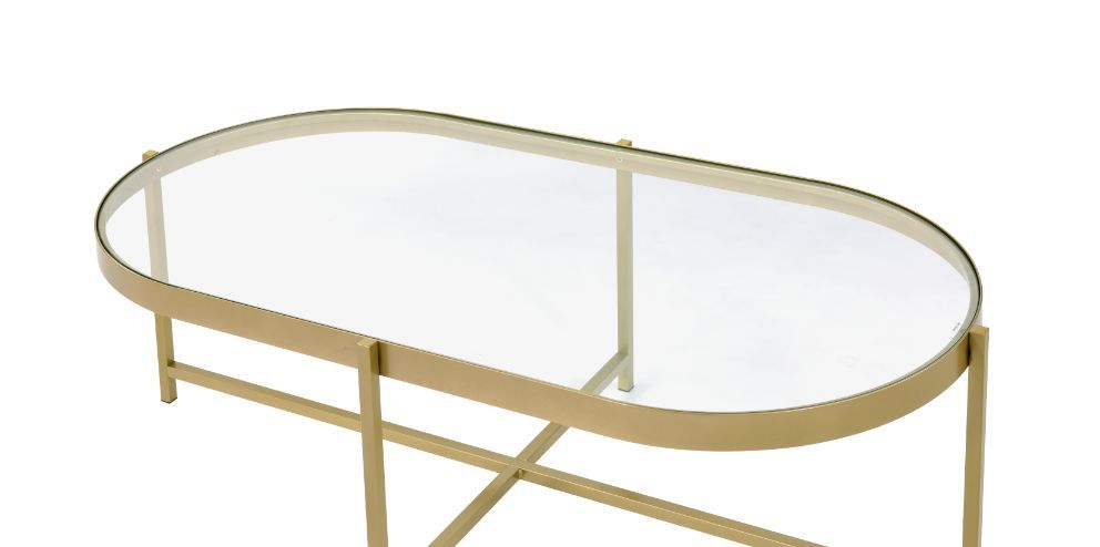 Simple design exhibits a real sense of style. The Charrot Coffee Table has a tempered glass top with oval shape design to give you a clean, spacious table top space. The lustrous gold finish showcases it-'s cross metal base and metal trim for a clean-line