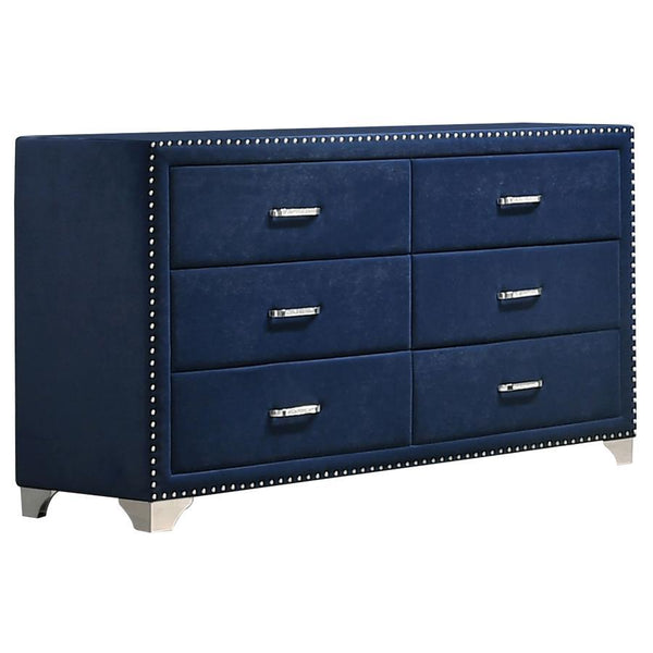Give outdated sleeping spaces a facelift with this eye-popping and elegant dresser. Entirely upholstered in velvet, this dresser is a conversation starter. It is equipped with six spacious drawers to store your bedside items. Nail head trim makes a specta