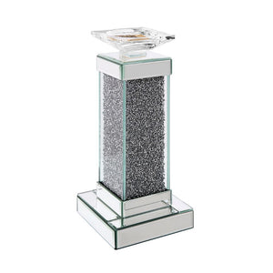 The Rekha candle holder collection fills your home with soothing scents and the simulating look of natural light. It is crafted from manufactured wood and features a mirrored frame with beveled edges and acrylic inlay. Available in two different sizes, ac
