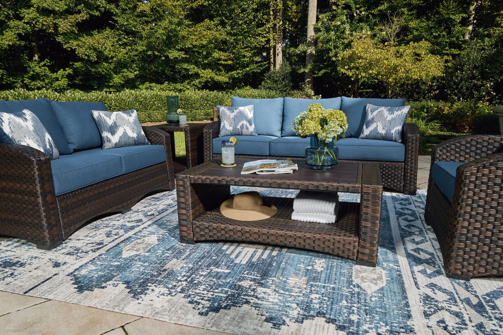 Brown resin wicker woven on an aluminum frame. High performance Nuvella fabric. Stainless steel hardware. Two throw pillows included with loveseat and sofa. <h4><b>Windglow - Blue/Brown - Sofa with Cushion</b></h4> <table width=-"100%-"><colgroup><col sty
