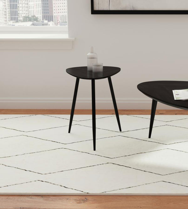 its deep black finish enhances its timeless elegance. The triangular tabletop features rounded corners