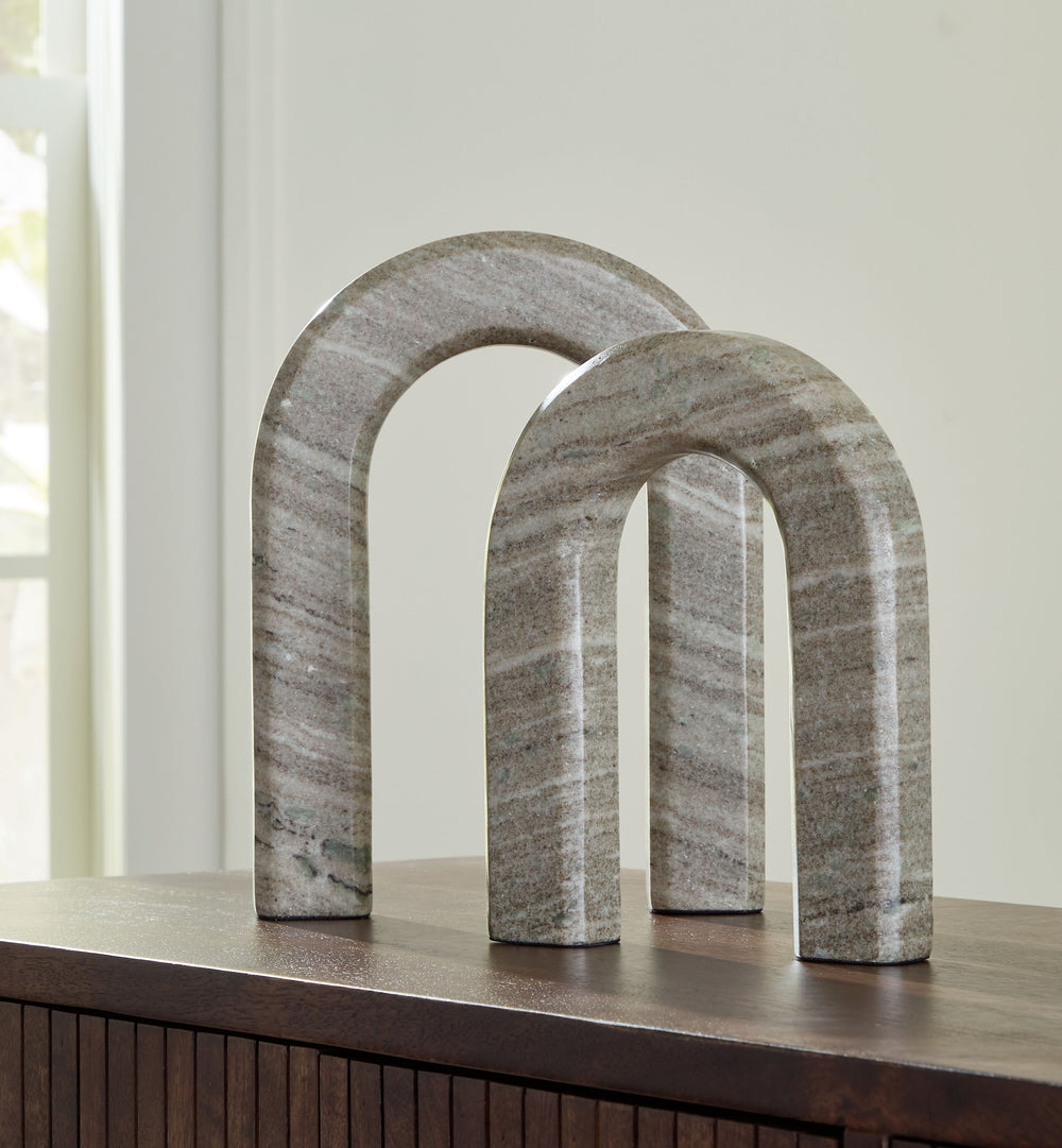 Timeless with its architectural silhouette, this sculpture set elevates your decor with the beauty of natural stone. The taupe marble construction is equally classic and contemporary. Displayed together or placed separately, these pieces maintain a refine
