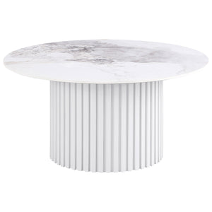 This round coffee table showcases a luxurious sintered stone top with elegant veining, offering durability and style for modern living spaces. The sturdy metal base features a fluted design and a sleek white powder-coated finish, providing a clean and con