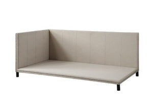 Clean lines, simplicity, and natural color create a calm, relaxing space where you can escape from your daily routine. The daybed is fully upholstered in beige linen for a light and airy feel. Nailhead trim detailing along the border enhances the elegant 