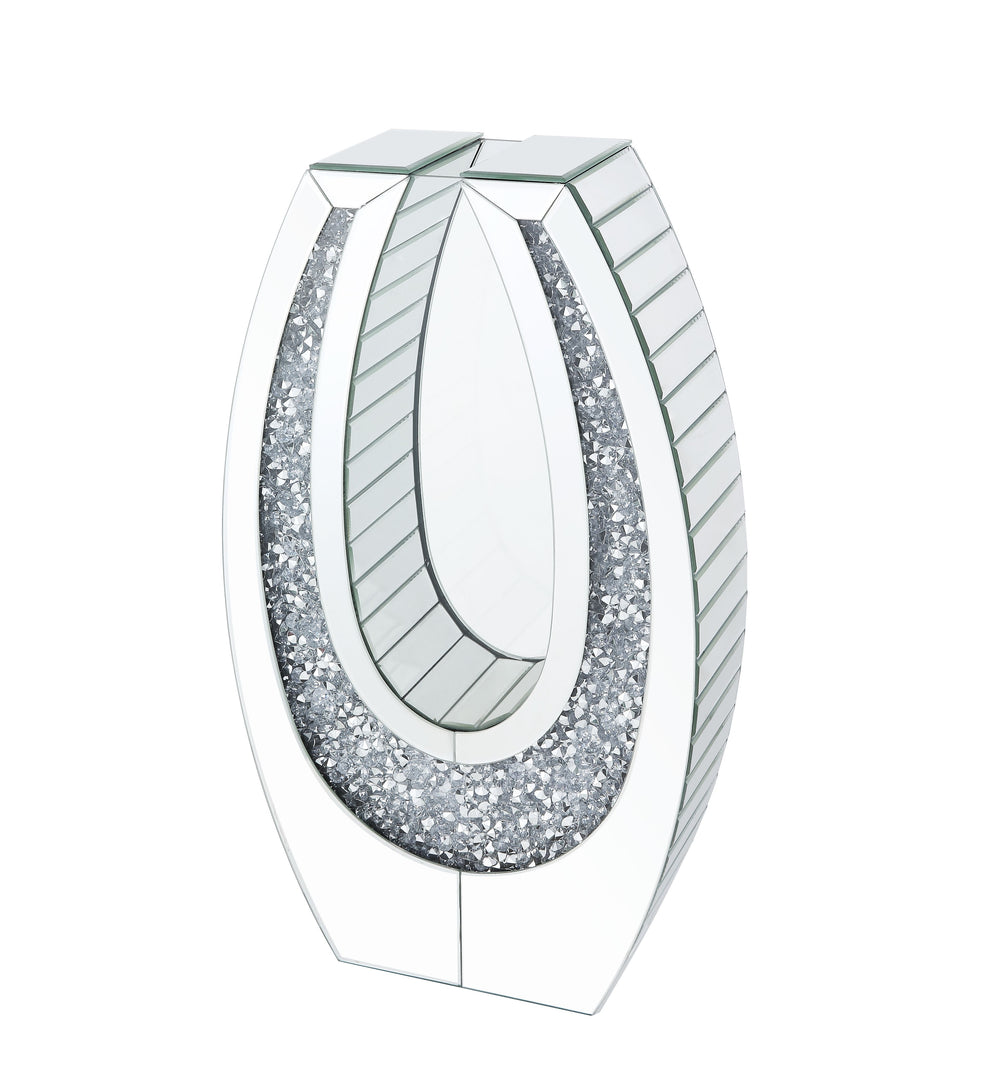 Display your dazzling sense of style with Noralie Accent Decor. Fitting in a variety of design aesthetic, this piece showcases an oval mirrored frame, with clear beveled glass surface and faux diamonds inlay that highlight its glamorous style. The accent 