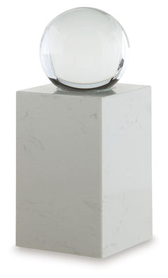 This exquisite sculpture effortlessly combines the purity of clear crystal with the timeless elegance of white marble. Contrasting textures and materials create a captivating visual experience, making it a striking focal point in contemporary settings. It