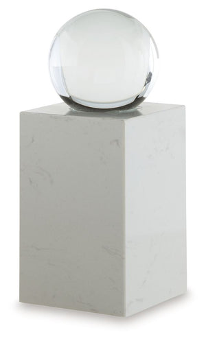 This exquisite sculpture effortlessly combines the purity of clear crystal with the timeless elegance of white marble. Contrasting textures and materials create a captivating visual experience, making it a striking focal point in contemporary settings. It