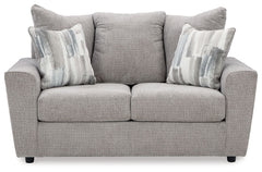 Whatâ€™s new in neutrals? Shades of gray, of course. Embrace the sophisticated design trend with this gorgeous loveseat, which offers a clean-lined, contemporary style at a comfortably cool price. Sure to lift your spirits, the plush chenille fabric is fa