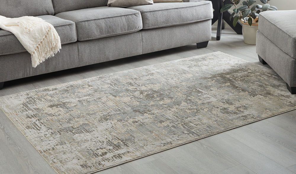 Bring your homeâ€™s intentional, free-flowing aesthetic to your floor decor with this rug. Mellow, earthy hues prioritize your relaxed view on style, forming an abstract pattern with a subtle sense of depth. From gentle morning journeys padding to the kit