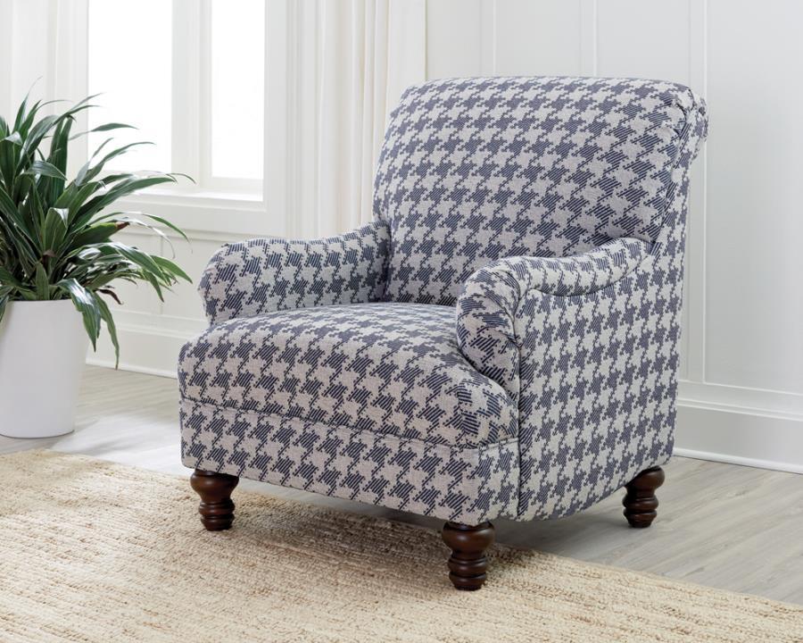 A standout houndstooth check pattern draws due attention to this fashionable accent chair. With tailored English arms and turned legs offering a contrasting espresso finish, this chair impresses with a blue and light grey upholstered cover. A solid wood f