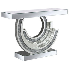 Make a dramatic statement with this glitzy mirrored console table, designed to dazzle from every angle. Its curved, swirl-inspired base creates a stunning three-dimensional look, adorned with smoke grey faux gemstones for extra sparkle. A mirrored tableto