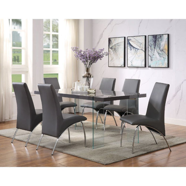 Add a modern touch to your dining room with the Noland dining room collection. With clear tempered glass legs serving as the table-'s base, this beautiful rectangular dining room table doubles as a piece of art for your dining room. The table stunning hig