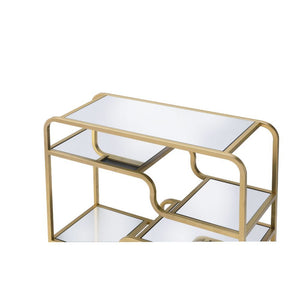  it features a mirror top with a stylish curving frame made of refined gold metal coating. A mirrored base and flo