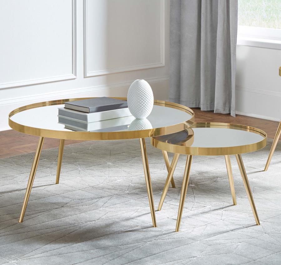 This coffee table set features two stylish, round tables with recessed mirrored tops. The larger table is paired with a smaller, complementary piece, offering a versatile design for your living room. Both tables are supported by a sturdy metal frame with 