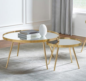  round tables with recessed mirrored tops. The larger table is paired with a smaller