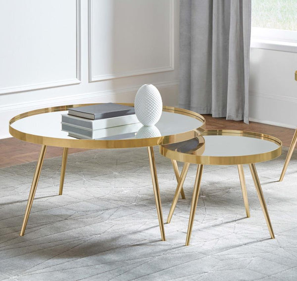  round tables with recessed mirrored tops. The larger table is paired with a smaller
