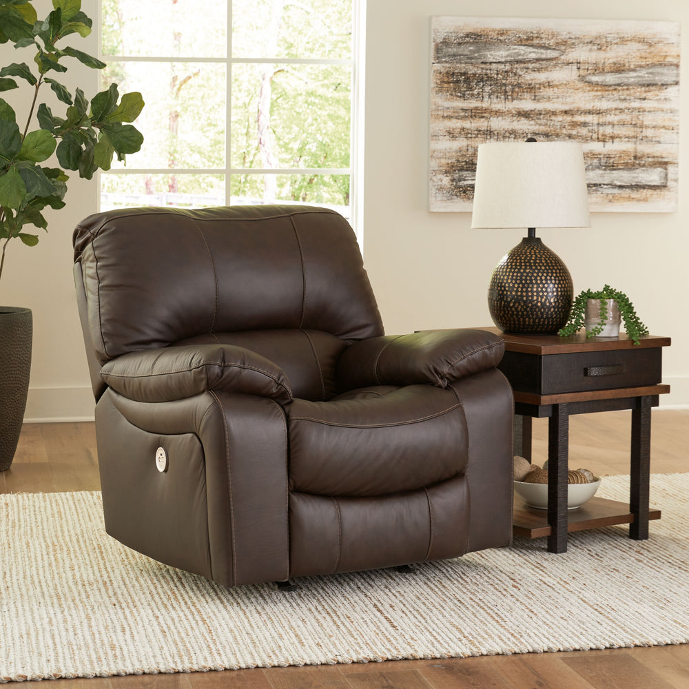 Focus on function. This practical power rocker recliner balances contemporary character and irresistible comfort. Its affordable, expertly matched leather and faux leather upholstery keeps your style up to speed without breaking the bank. Reclining with t