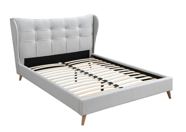 Every element from the wing back styled headboard, light gray upholstery, and button tufting exudes timeless elegance and contemporary comfort. The fully upholstered bed features a distinct and sophisticated headboard designed with wing back and button tu