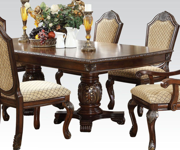 The Chateau De Ville traditional dining collection features elegant styling decorative carving and a combination of exotic materials. The double pedestal dining table with extended two leaves is accented by decorative base and feet. Matching hutch and buf