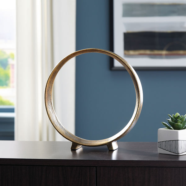 this sculpture rounds out your decor in sleek style. The antiqued brass-tone finish has a rustically luxe look that remains versatile