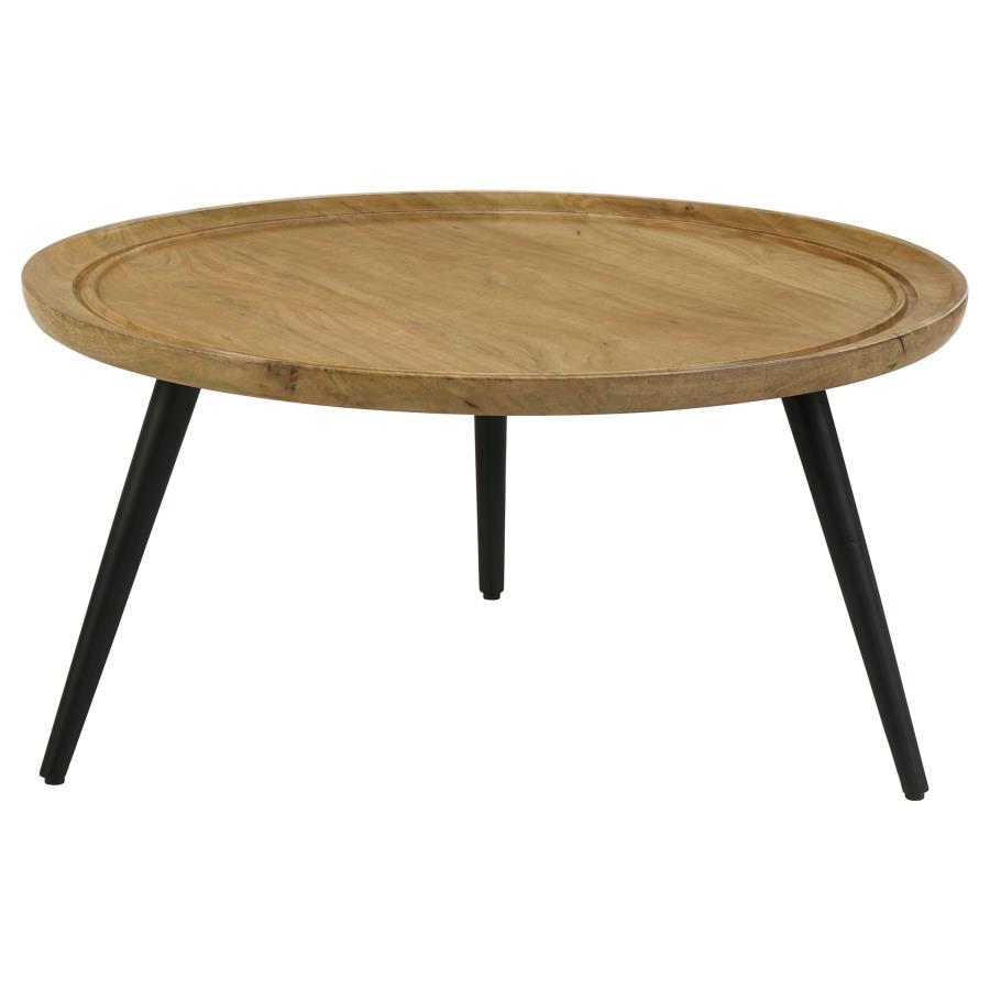 This round coffee table merges mid-century charm with rustic appeal for a timeless addition to your living room. Crafted from solid mango wood with a natural finish, it showcases unique wood grain patterns and a softly beveled edge for a subtle dish-like 