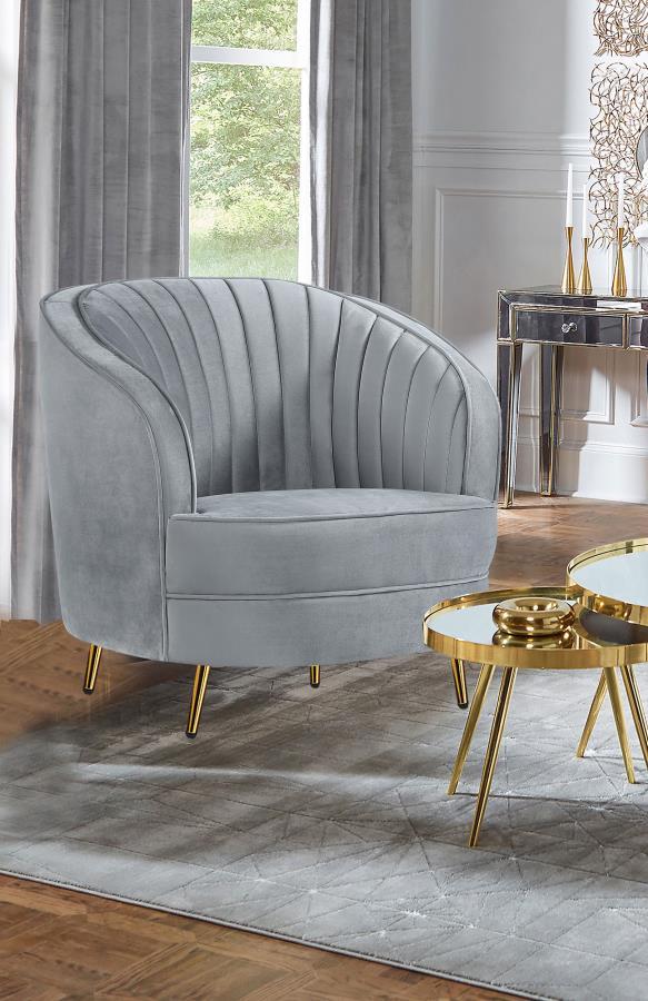  while plush cushioning and gold tapered legs provide comfort and modern s