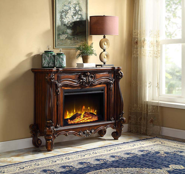 Gather the family around the Versailles fireplace in cherry. Traditional details such as scroll legs and carvings make this piece a masterpiece. It comes equipped with fire safety technology that continuously monitors the temperature of the plug and will 