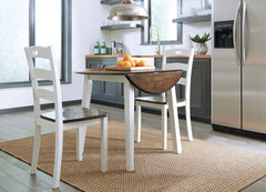 Made with Birch veneers and select hardwood solids in a distinctive two-tone cottage finish. Cream table base and chair frame with medium brown color table tops and chair seats. Updated cottage styling, table has arched aprons and chair has pierced ladder