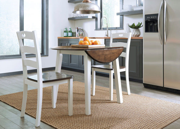Made with Birch veneers and select hardwood solids in a distinctive two-tone cottage finish. Cream table base and chair frame with medium brown color table tops and chair seats. Updated cottage styling, table has arched aprons and chair has pierced ladder