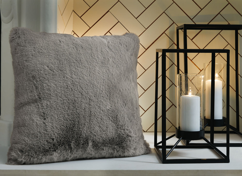 Soft, subtle and sensational. The plush feel of this faux rabbit fur pillow will drive you wild. Its dark gray hue pairs with a variety of decor, from casual to contemporary.<br/><br/><b>Product Features</b><ul><li>Made of polyester</li><li>Soft polyfill<
