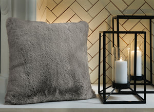  subtle and sensational. The plush feel of this faux rabbit fur pillow will drive you wild. Its dark gray hue pairs with a variety of decor