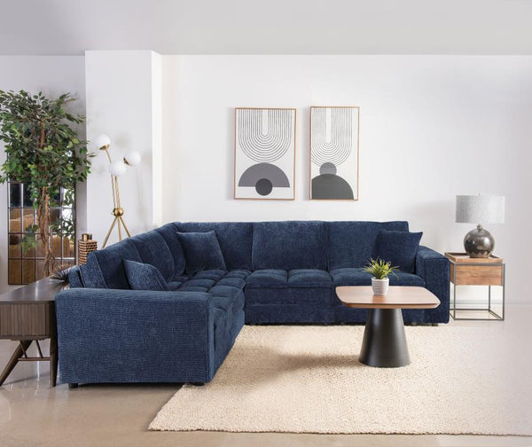 This retro-inspired modular sectional brings a blend of comfort and contemporary style to your living space. Featuring soft blue corduroy upholstery and a sophisticated grid-tufted design, it delivers both elegance and coziness. The fully encased solid an