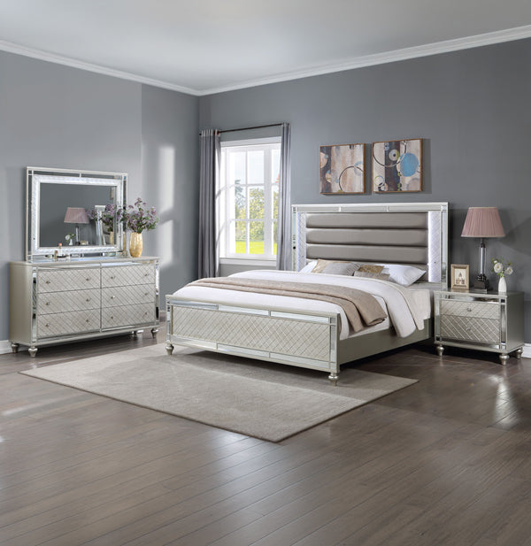 Elevate your sanctuary with this dazzling bedroom collection, where contemporary chic meets timeless charm. The suite boasts a stunning silver finish, imbuing your space with an air of sophistication and modern luxury. At the heart lies a plush, channel t
