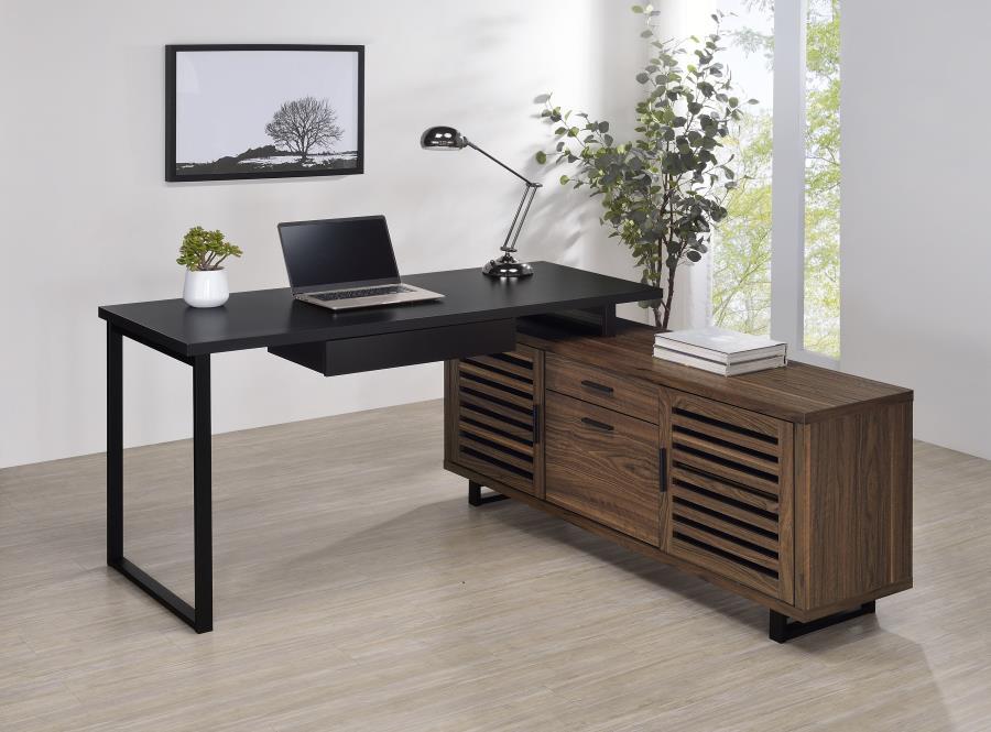 Create a custom workspace that maximizes both style and efficiency with this modern L-shaped executive desk. It features a high/low configuration, with a black finished workspace and drawer on one side and a storage credenza on the other. The credenza off