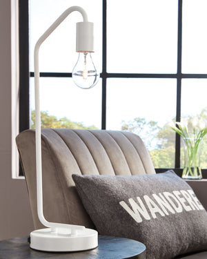  this desk lamp suspends its exposed bulb in one sleek swoop. Constructed of metal