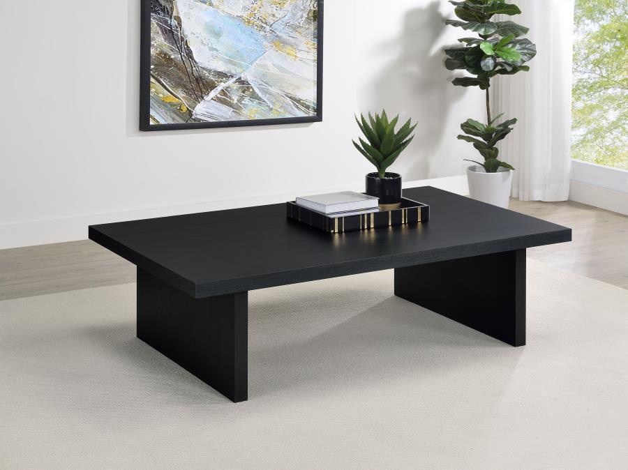 This contemporary coffee table establishes a strong visual focal point in any living room. Its streamlined silhouette, rectangular shape, and refined black finish enhance modern minimalism. Crafted with an engineered wood core and protected by scratch-res
