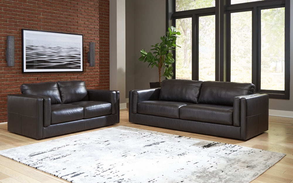 Keen on crisp, contemporary design? Adore the pleasure of leather? Look no further. This sofa and loveseat set satisfies on every level. Richly textured and decadently supple, the plush cushions are wrapped with combination leather and faux leather uphols