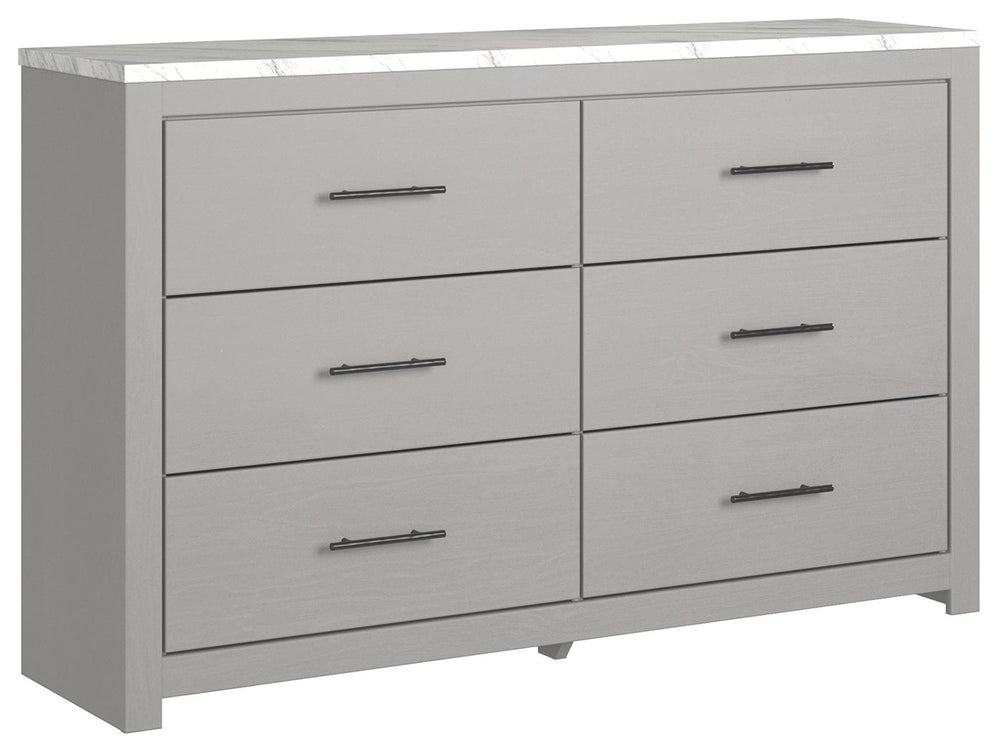 Cool, clean and casually modern. This dresserâ€™s wispy dove gray finish and faux Calcutta marble top set the tone for your calming sanctuary. Large linear pulls add dimension and authenticity. Six smooth-gliding drawers neatly accommodate your wardrobe n