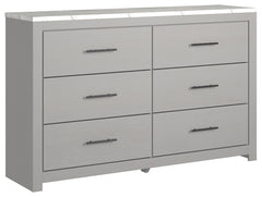 Cool, clean and casually modern. This dresserâ€™s wispy dove gray finish and faux Calcutta marble top set the tone for your calming sanctuary. Large linear pulls add dimension and authenticity. Six smooth-gliding drawers neatly accommodate your wardrobe n