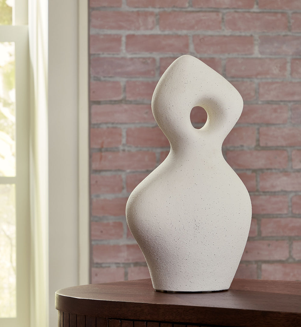 Poetry in motion. A simple and fluid form becomes a smooth touch of contemporary art in this ceramic sculpture. A gorgeous addition to an accent table or bookcase, it-'s simply striking from every angle.<br/><br/><b>Product Features</b><ul><li>Made of cer